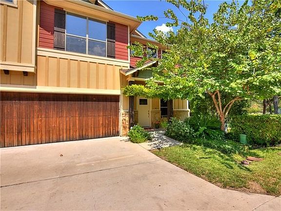 The front yard tree provides privacy and shade to the front porch