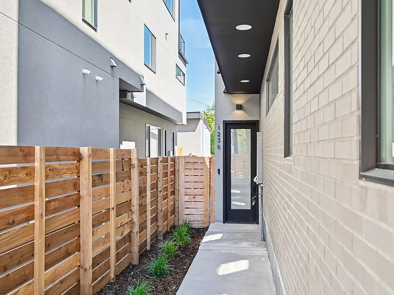 Front door is tucked back off the street and private. Includes video doorbell and wifi smart locks on front and back doors