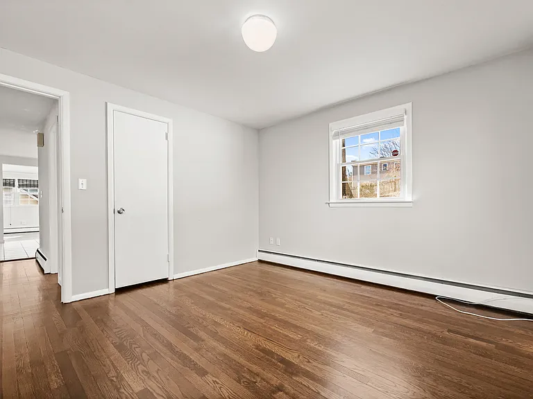 First floor bedroom- spacious with hardwood floors.