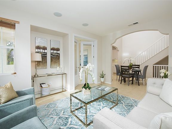 The living space opens to the kitchen and is perfect for entertaining.