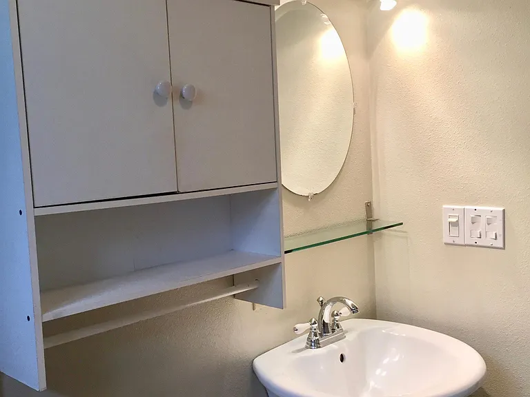Bathroom with pedestal sink.