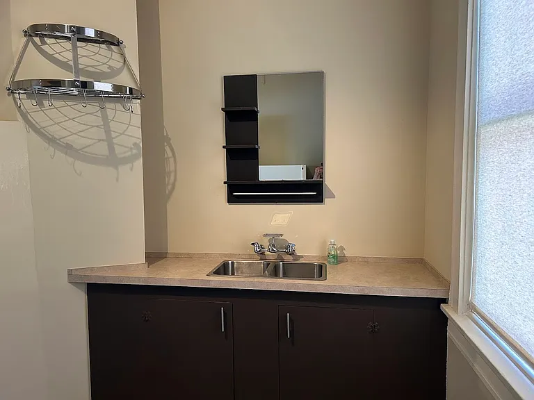 Kitchen sink area. Large storage area in cabinets underneath