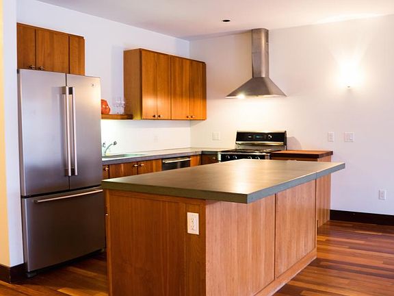 Kitchen. Concrete counters and cherry counters.