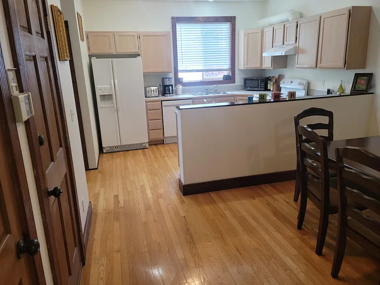 Open floor plan from living room, through dining room and into kitchen