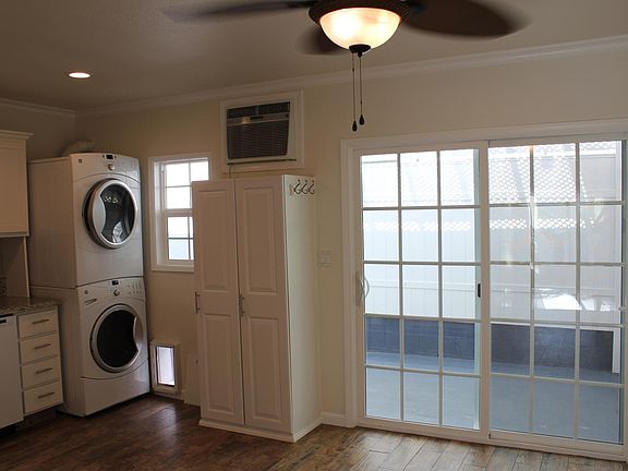 sliding glass door to covered lanai patio, ceiling fan and a/c