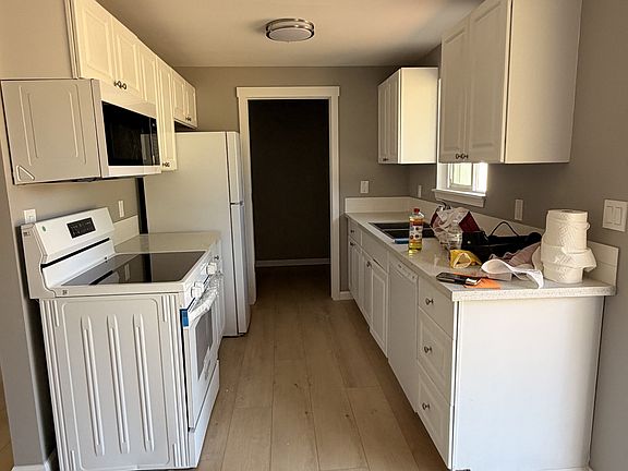 Kitchen with walk in pantry through rear door