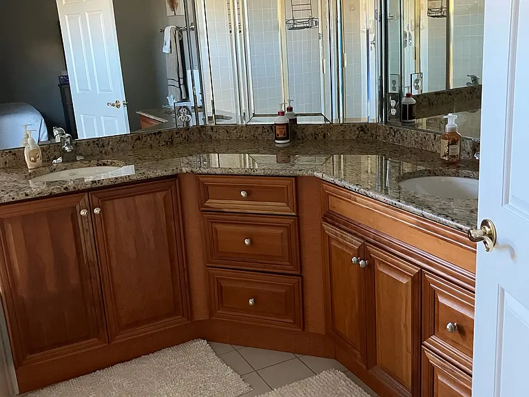 Cherry cabinets in master bath with granite counter tops