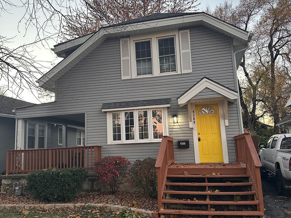 New walkway, fresh paint, new landscaping and a yellow door.