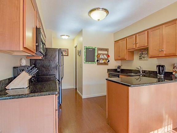 Newer cabinetry and granite counter tops, all appliances are staying.