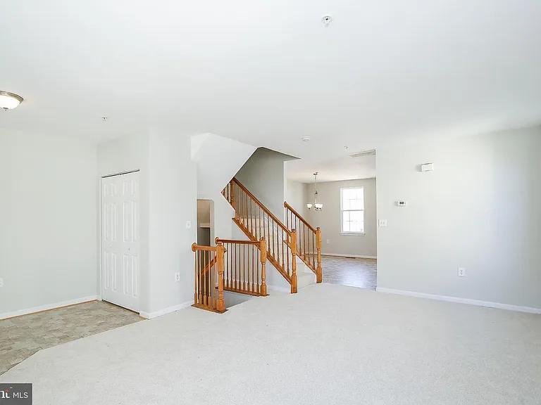 Living room and different angle of front entrance.