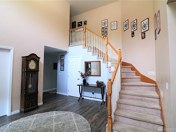 Entry way with staircase leading upstairs