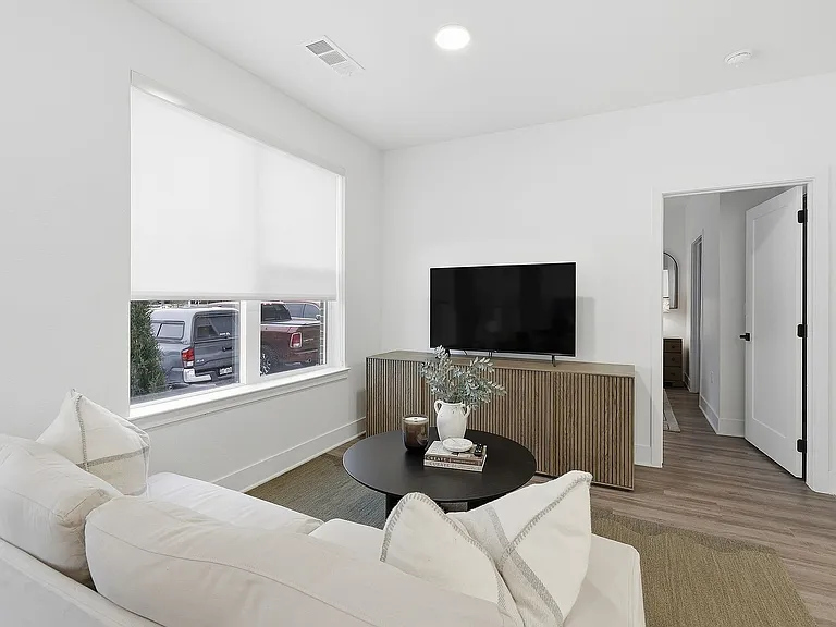 Cozy living space with a comfortable sofa and modern entertainment setup