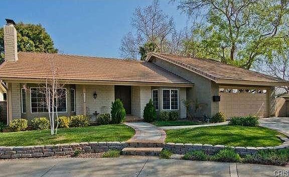 Front of House with Beautifully Landscaped Yard.