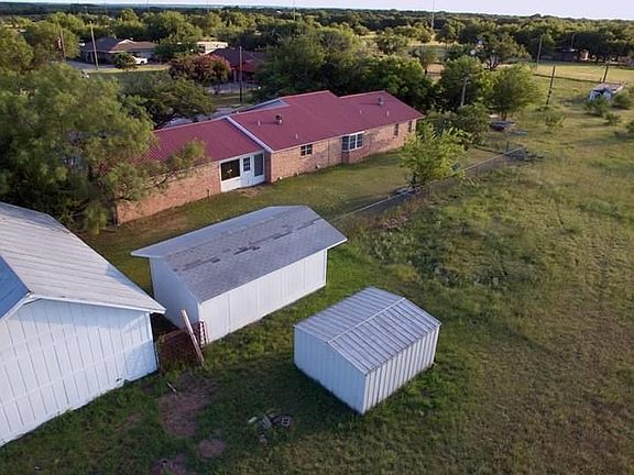 THREE OF THE BUILDINGS ON THE PROPERTY.
