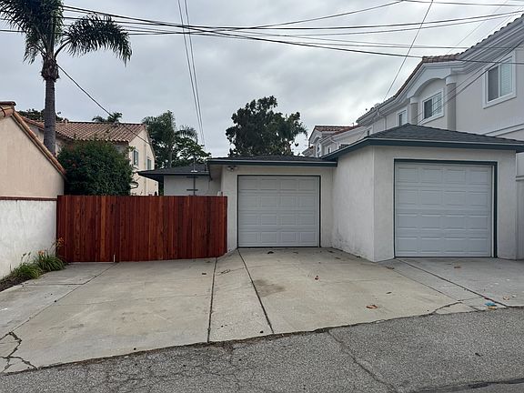 Back of house off alley- Fence is entrance to home.