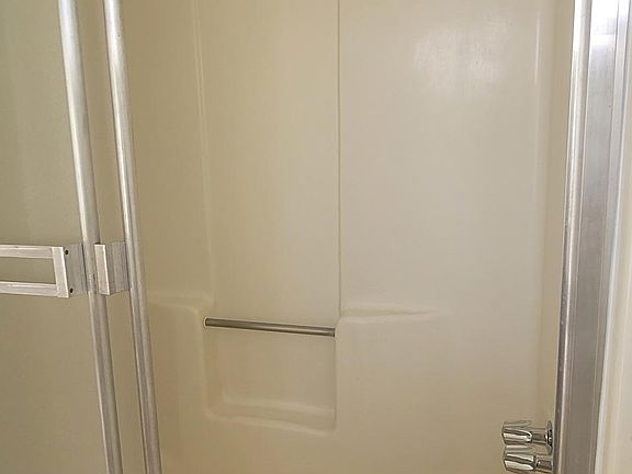 Shower door and bathtub
