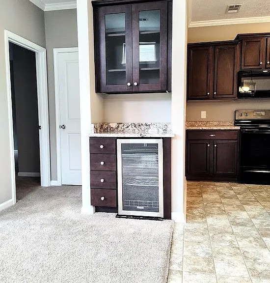 The living area also features a bar area and wine cooler.
