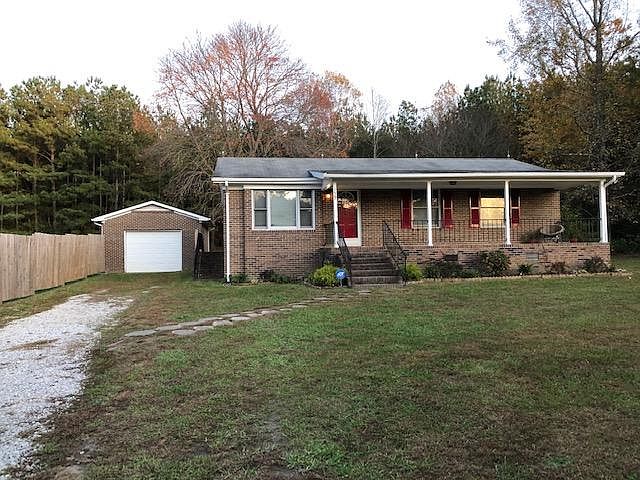 Home on private wooded lot with large front and back yard