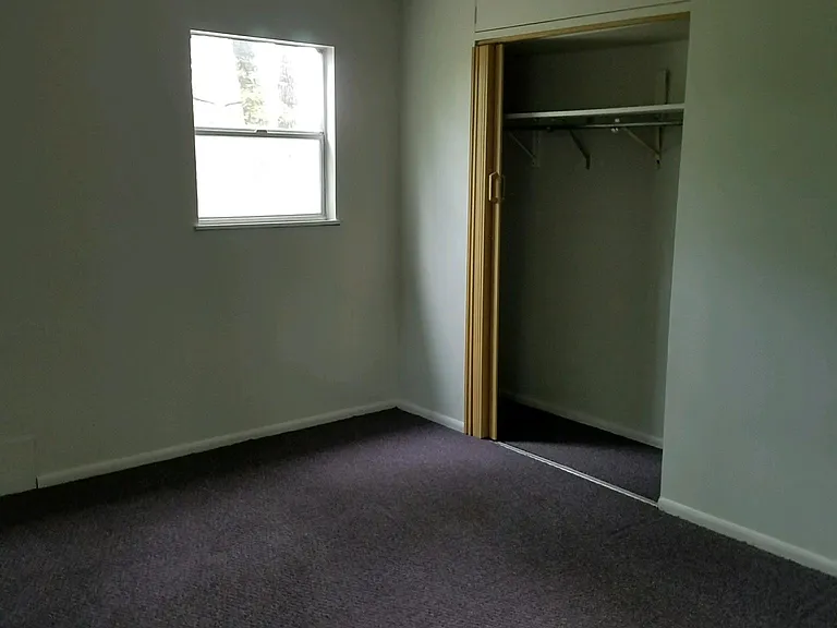 First of three bedrooms on second floor (10.5' by 14').