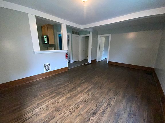 Large living / dining room with hard wood floors.