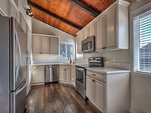 Kitchen with quartz countertops and stainless steel appliances
