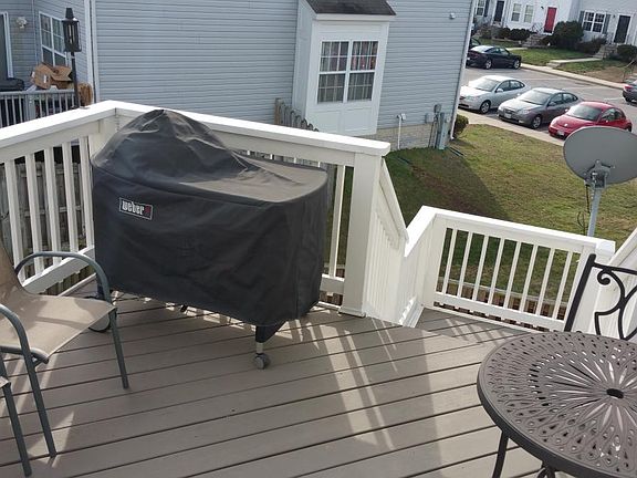 Deck, includes wrap-around stairs down to fenced yard