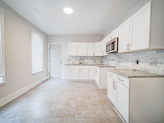 Kitchen includes a stove and fridge