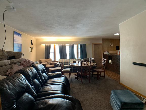 Huge living room, bar area, bedroom #1 doorway in rear of living room