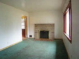 Living room with stone fireplace