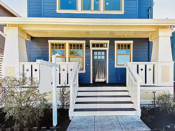 Gracious front entry with sitting porch.