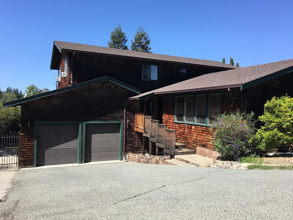 Driveway and 2.5 car garage with storage