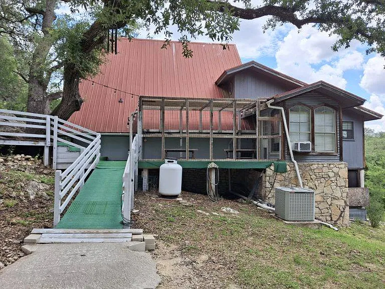 Drive way view of catio and side of house