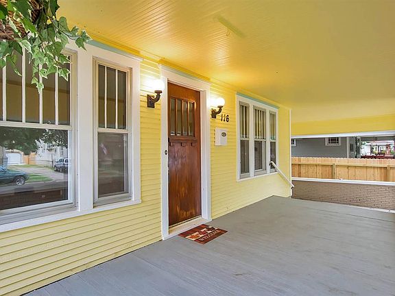 Front porch has hooks ready for your plants or porch swing.  House faces West, so you can see the sun set from here.