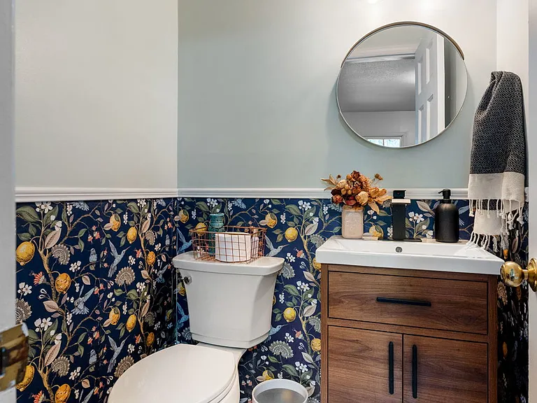 Close up of 1/2 bath in utility room off of kitchen
