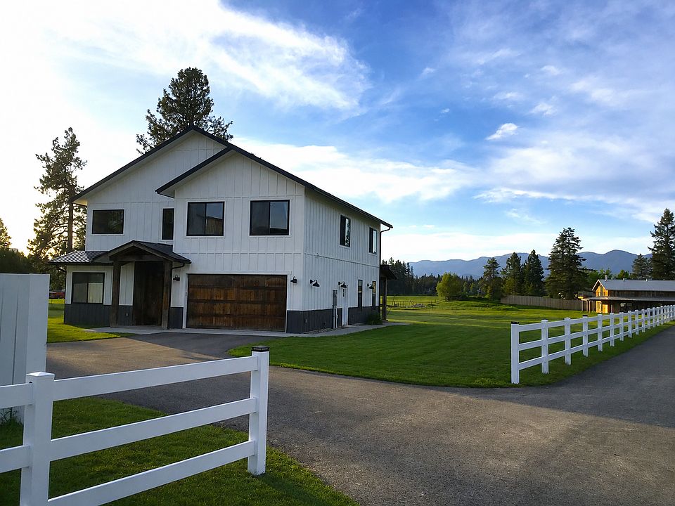 216 Cowboy Drive - Private gated entrance to the exclusive Cowboy Estates community, where only four residences share a peaceful Montana setting surrounded by open skies and towering pines.