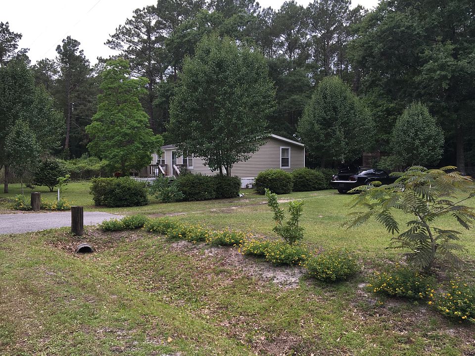 Mobile home and two (2) lots