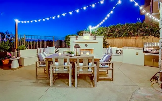 Fully fenced in backyard with fireplace and BBQ area perfect for entertaining
