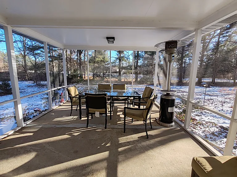 Screened porch. Beyond the trees is Plainsboro Park.