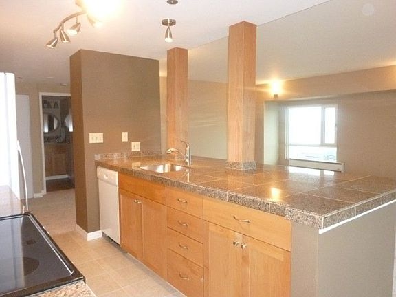 Open floor plan with awesome sweeping view while preparing meals in the kitchen. Entertainment style