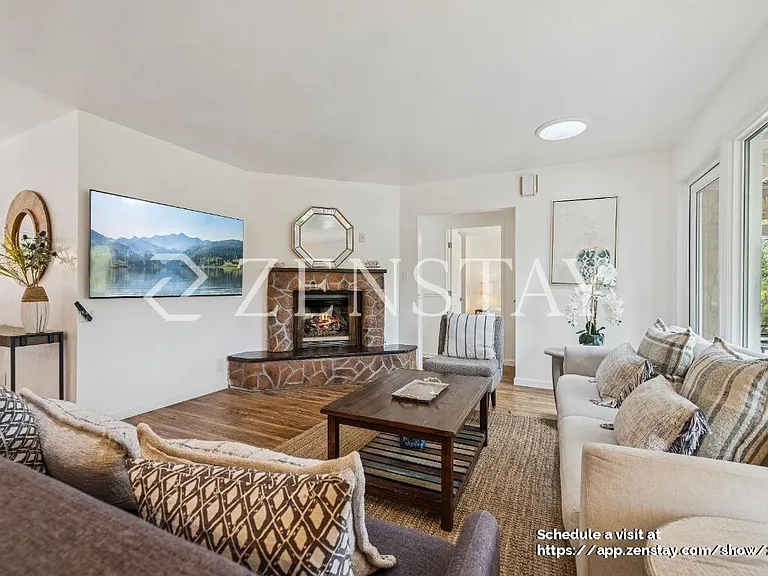 Open Living Room with Gas Fireplace and Smart TV
