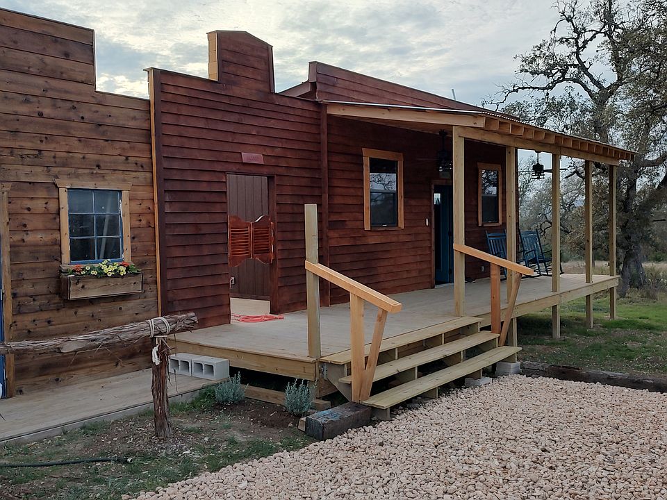 This is the front of the cabin. It is adjacent to the property well house, not another cabin. It is a single family cabin, not a shared space.