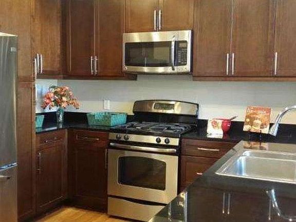 Fully upgraded kitchen with wood floor