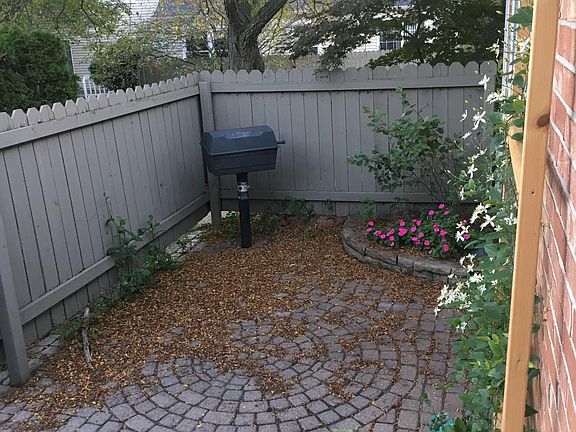 Private, shaded patio with gas grill