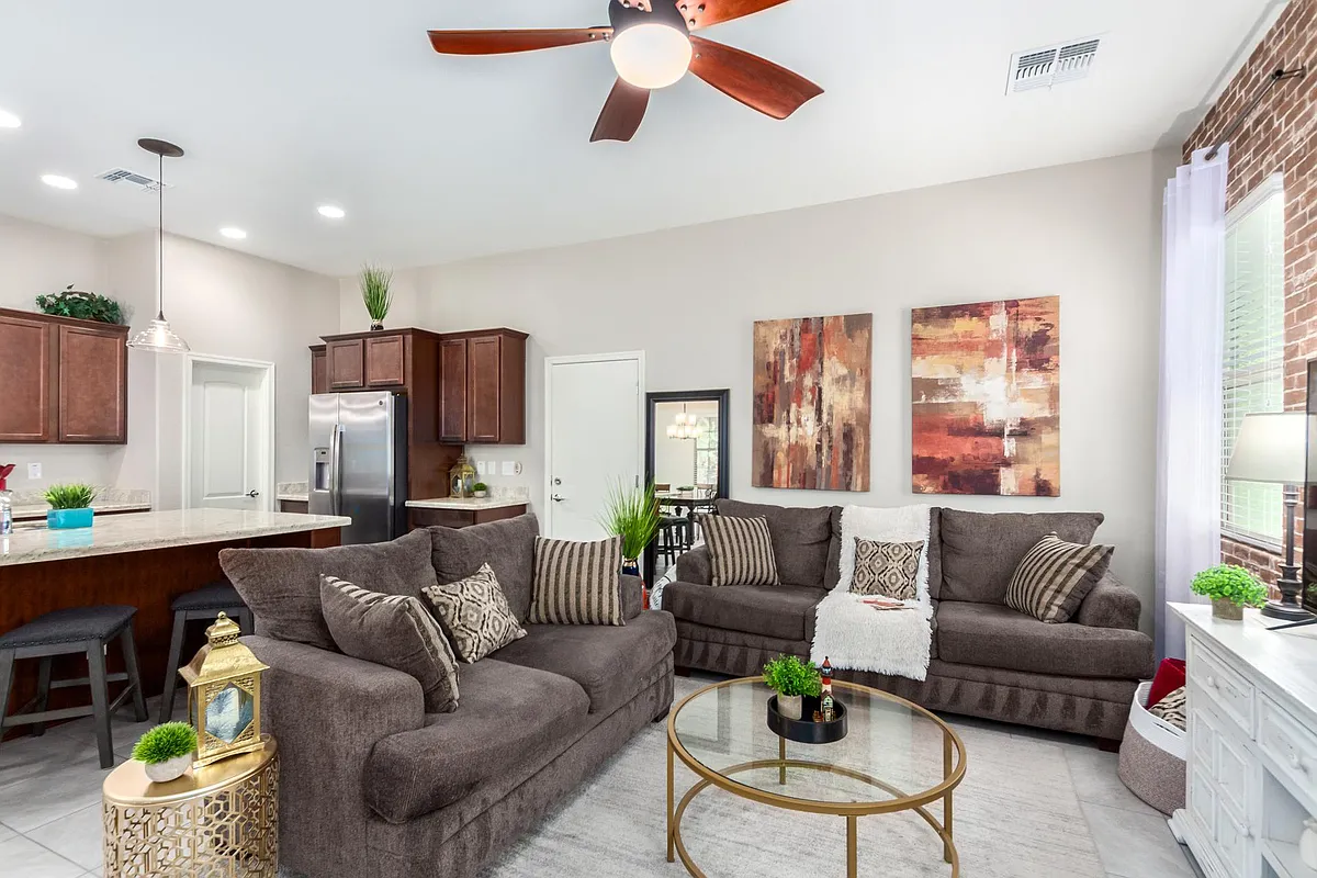 Rare 10-foot ceilings create an exceptionally spacious feel, complemented by modern two-tone warm light gray paint throughout the first floor. - 2483 N 149th Ln