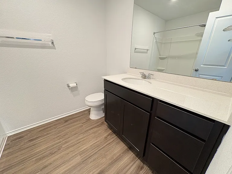 Primary bathroom, tub + shower