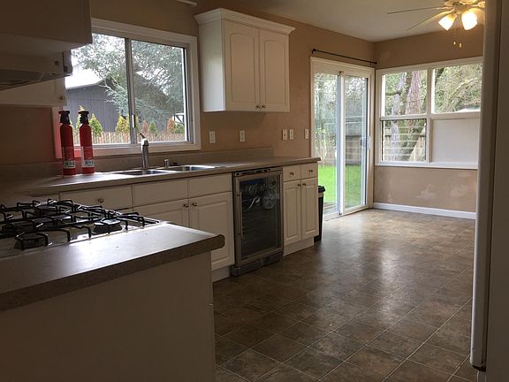 Kitchen with natural Gas Stove, gas range and built in Wine Fridge that holds 50+ wine bottles.