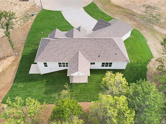 Back overview of current Cypress Spec home at 5 Schaper Farms Ct including optional covered patio.