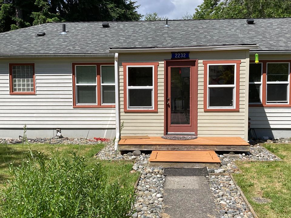 Back of duplex with entry through shared mudroom.