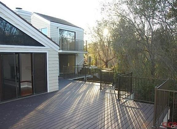 New Trex deck and railing backs up to creek