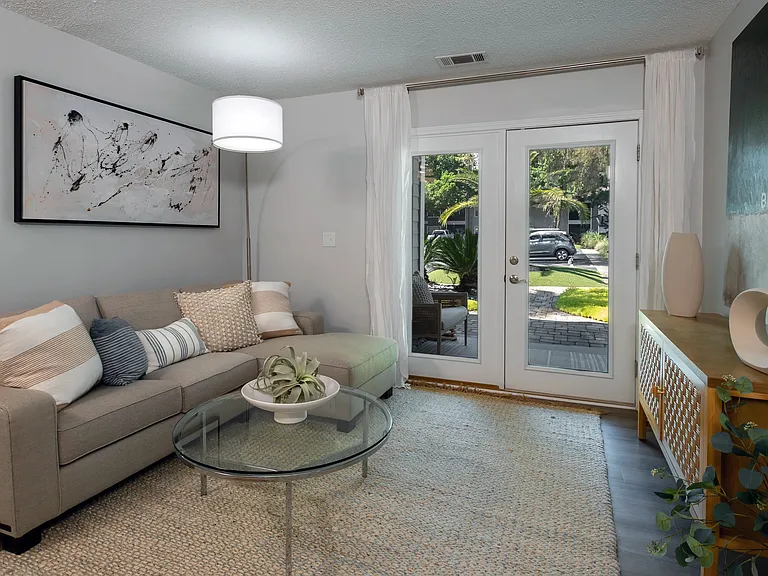 Embrace upscale living in our bright, spacious living rooms with French doors, inviting you to extend your living space to a private screened-in patio or balcony.